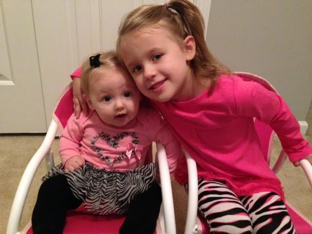 Sweet Sisters in Matching Rocking Chairs